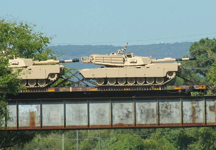 M1A1s on RR flatcars.